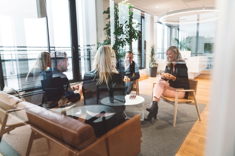 people meeting in an office reception room 