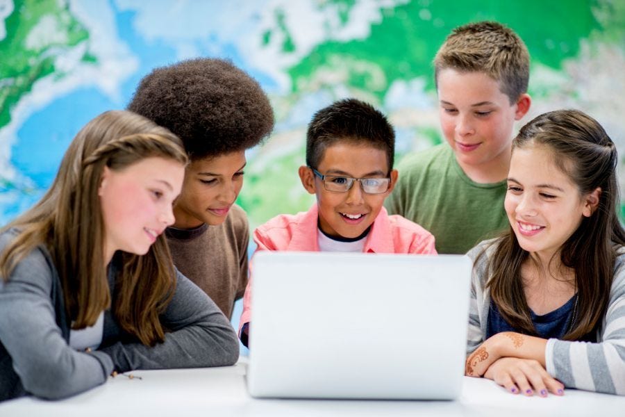 Students gathered around a computer