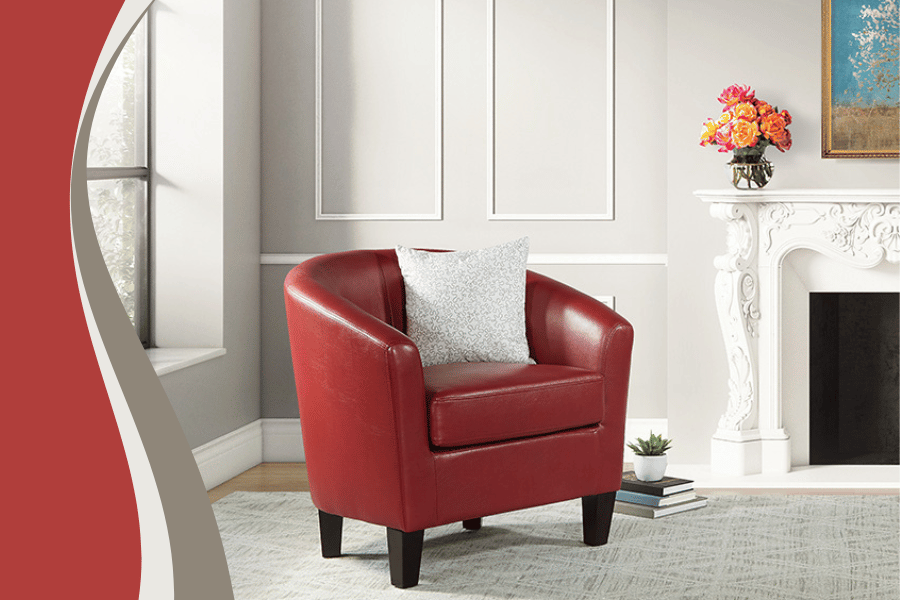 A vibrant red club chair positioned in an elegant living room beside a cozy fireplace.
