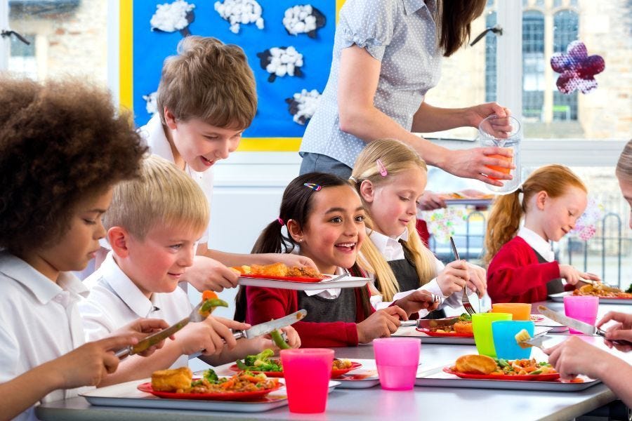 Students eating lunch in a school cafeteria