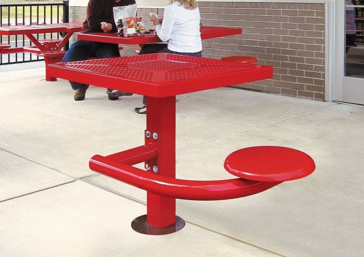 Bright red one-seater outdoor picnic table. 