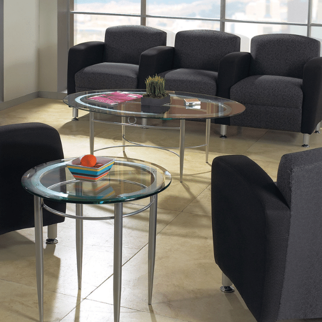Worthington Direct Reception room with dark gray soft seating for guests.
