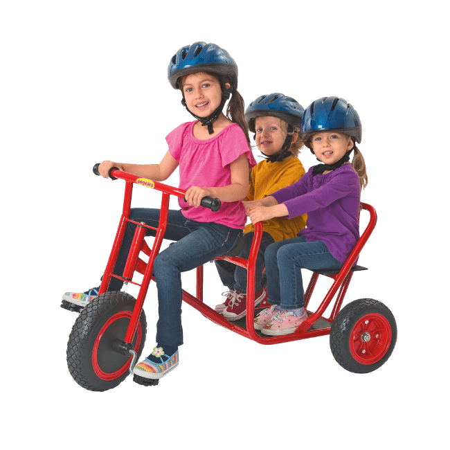 Three preschool children riding on a taxi trike. 