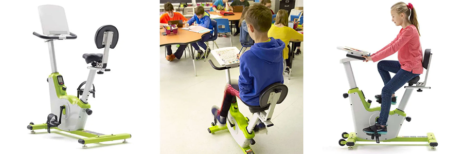 Student riding stationary classroom buke while reading. 