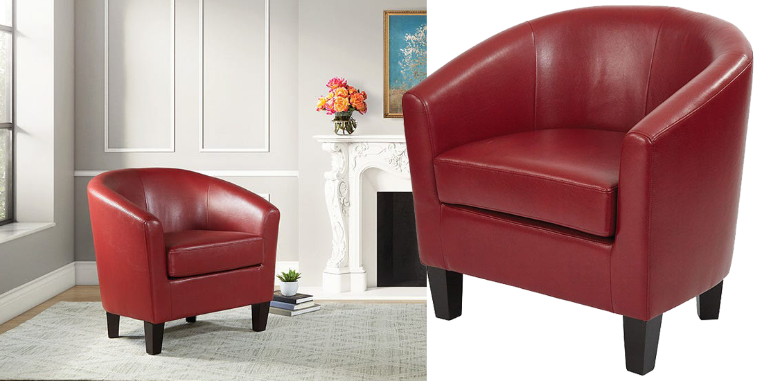 A vibrant red club chair positioned in an elegant living room beside a cozy fireplace.