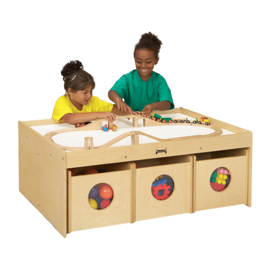 Children playing at an activity play table.