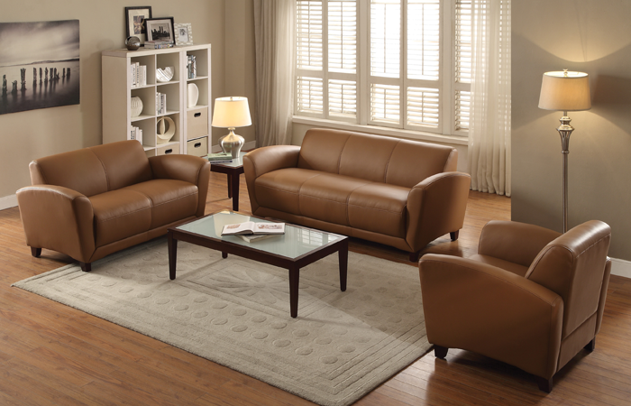 Cozy waiting room with brown couch and chairs