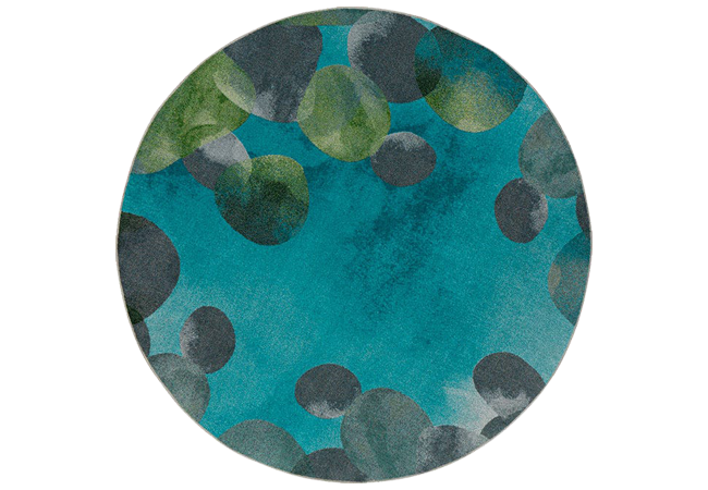 Worthington Direct Round classroom carpet featuring calming turquoise, blue, and gray hues with splashes of tranquil green, depicting an abstract river rock design.