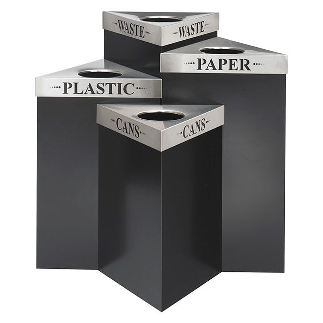 Four triangular-shaped recycling and trash receptacles nested together to form a compact unit.