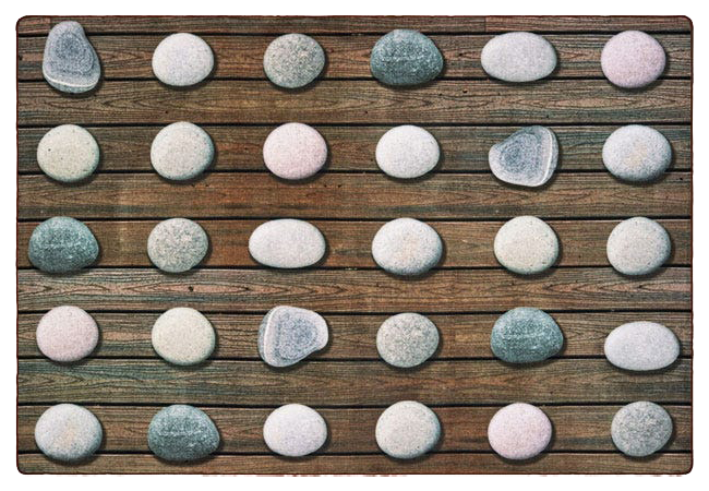 Worthington Direct Classroom carpet featuring a row of river rocks for preschoolers to sit on, set against a wood grain background.