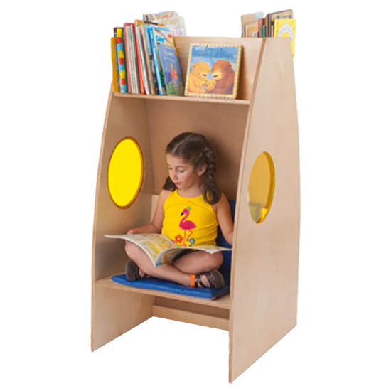 Young student sitting in the Alone Zone reading a book. 